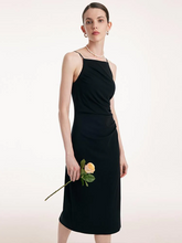 a lady in black midi slip dress